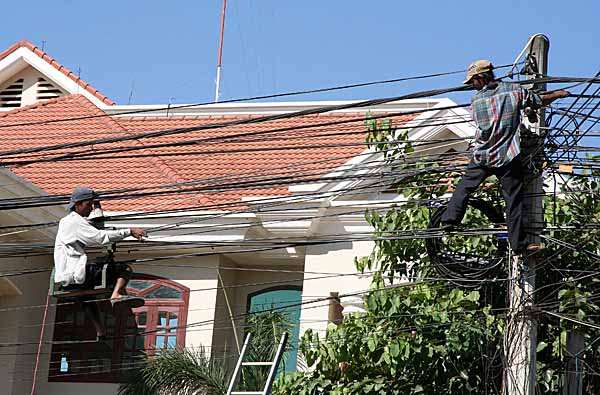 Repair of power cables in Seam Reap, Cambodia.