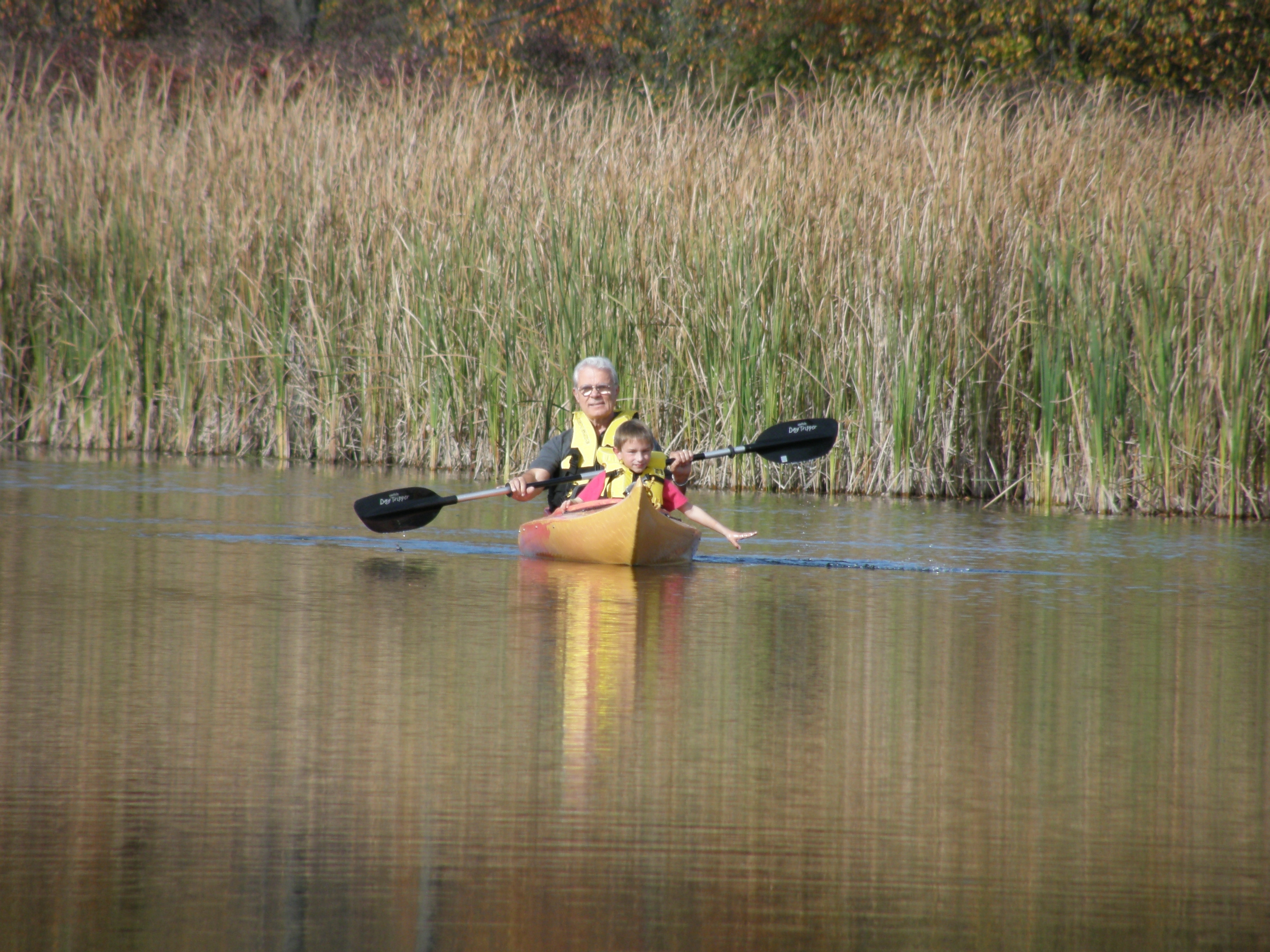 Oct. 13 Papa and  Evan went kayakking on the pond before the Limings left .JPG