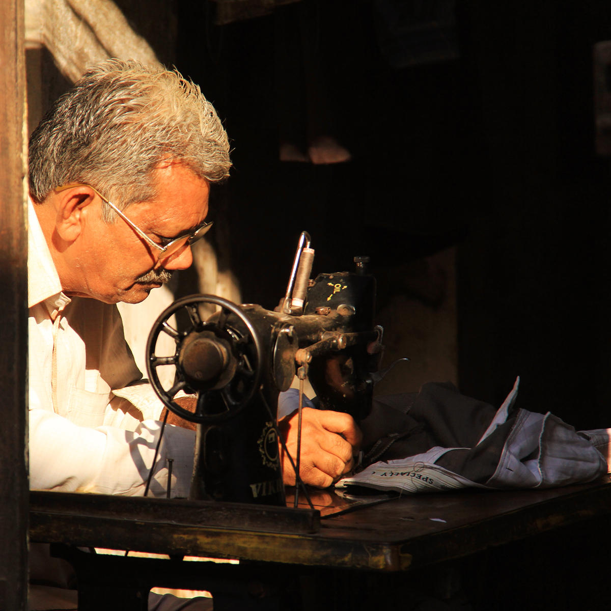 Patan tailor at work.jpg