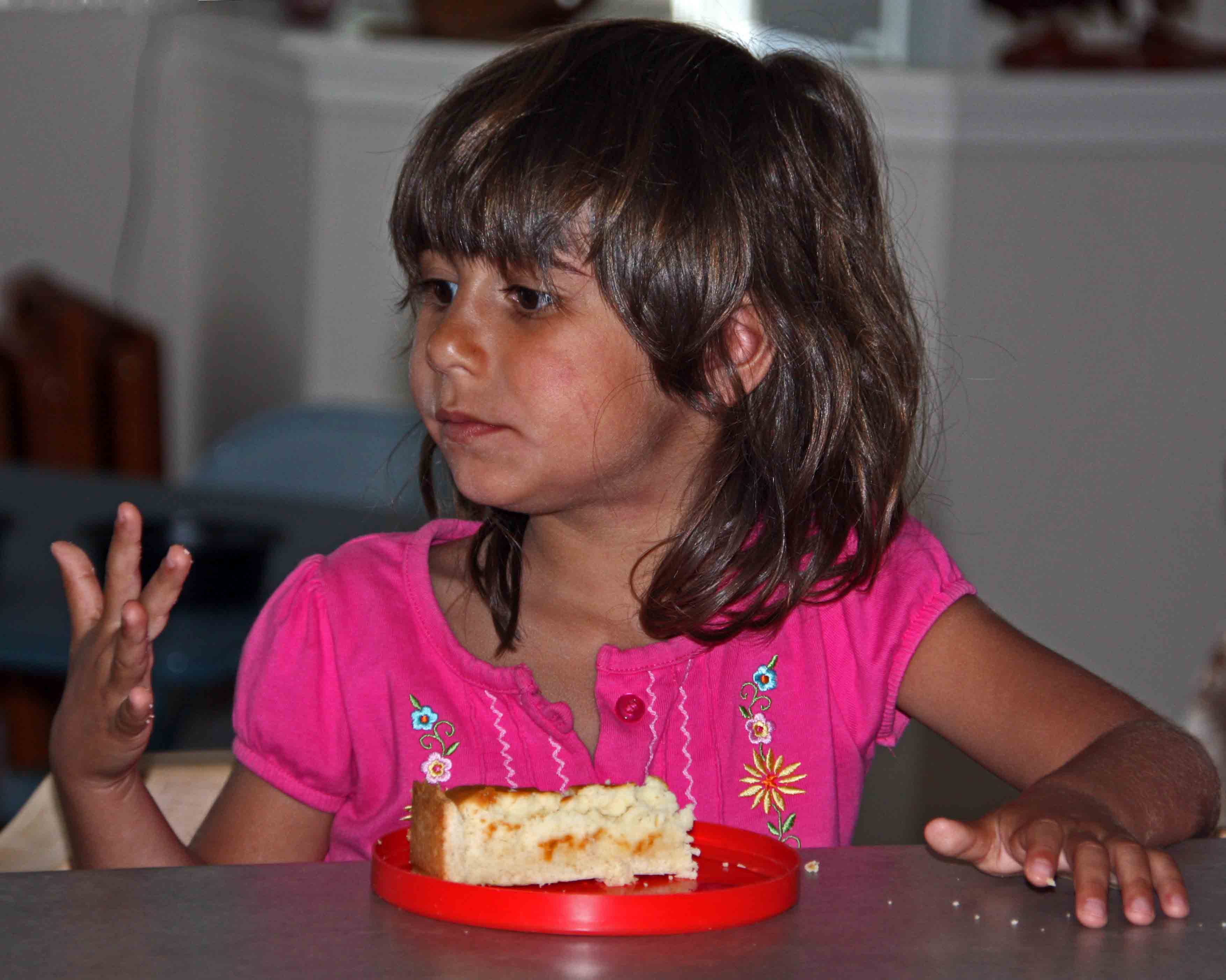 Maya enjoying her lemon cake