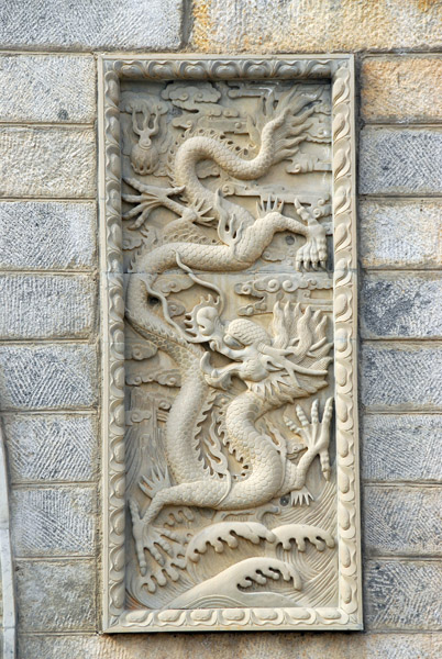 Stone dragon on the gate to Kumbum Monastery