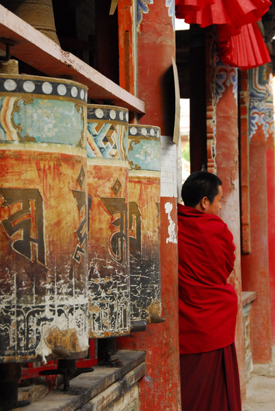Prayer wheels and a monk