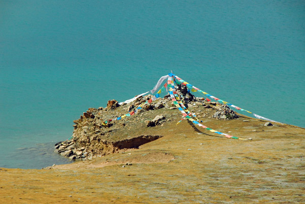 Prayer flags on the shore of Cuonahu Lake, Tibet