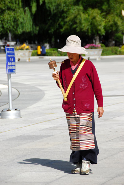 Tibetan woman with a prayer wheel