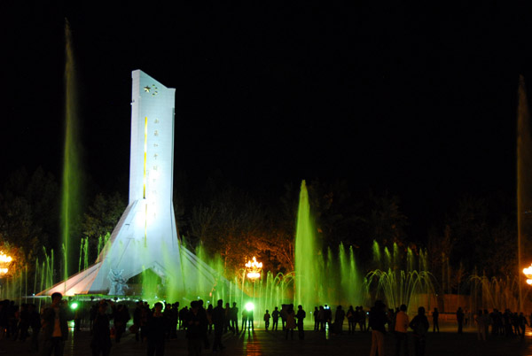 Monument to the People's Liberation of Tibet and the Potola Square fountain at night, Lhasa