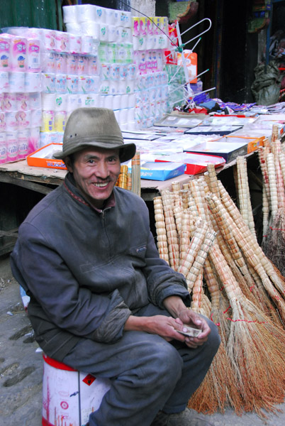 Street stall with brooms and toilet paper