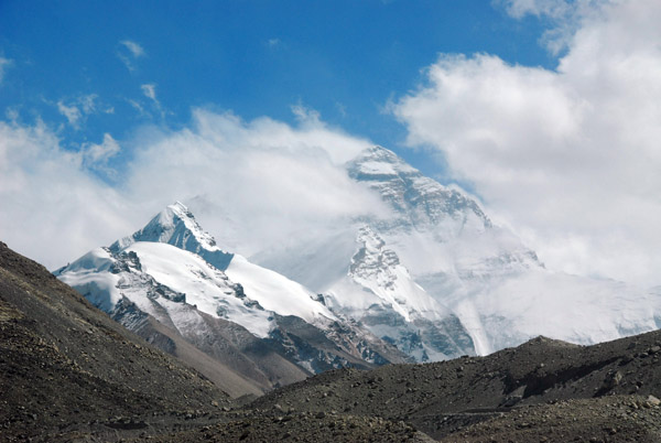 Mount Everest trying to reemerge from behind the clouds