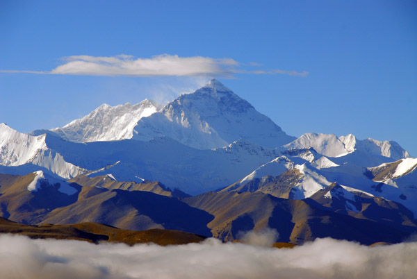 Mt Everest rises high above a low cloud deck obsuring the valley south of Pang-la Pass