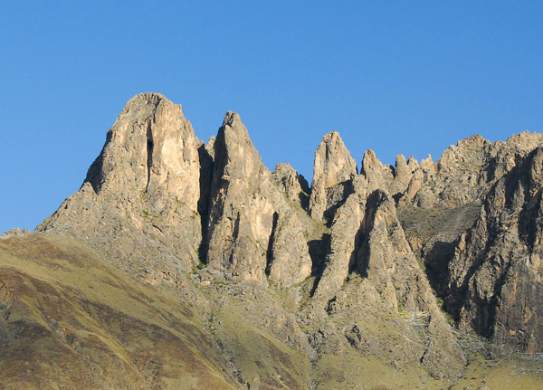 Rugged rocky pinnacles rising over Lhasa