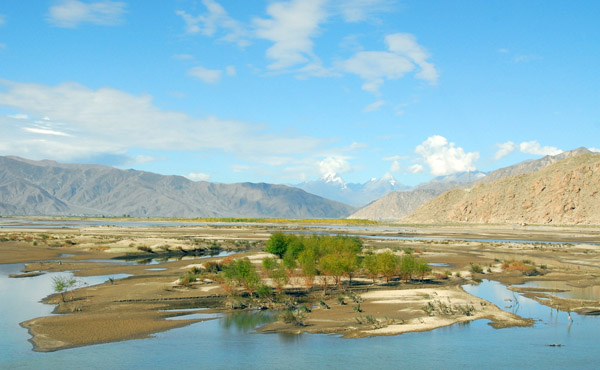 In India, the Yarlung Tsangpo River  becomes the Brahmaputra