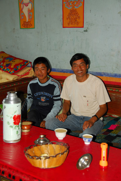 The driver and his son with yak butter tea