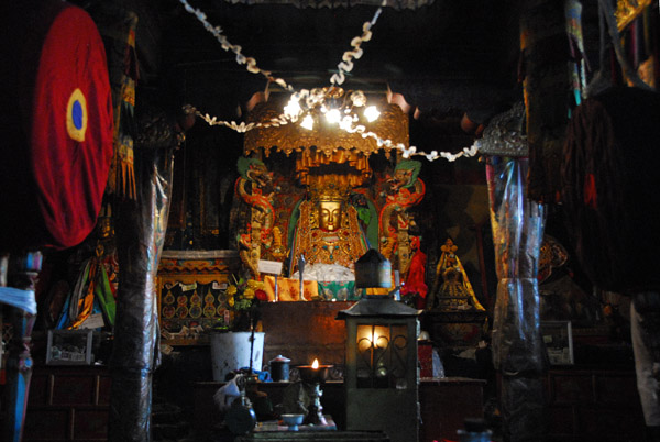 Interior chapel dedicated to the kings of Tibet with Buddha statue (Jowo Norbu Sampel Gulyendho)