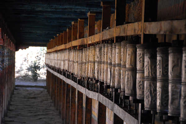 Prayer wheels of the kora circuit around the perimeter of the Tsuglagkhang at Trandruk Monastery