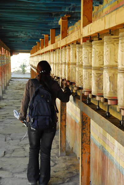 The guide spinning the prayer wheels