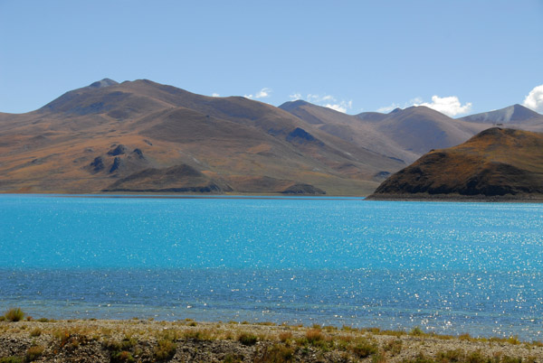Looking across the blue water of Yamdrok-tso Lake