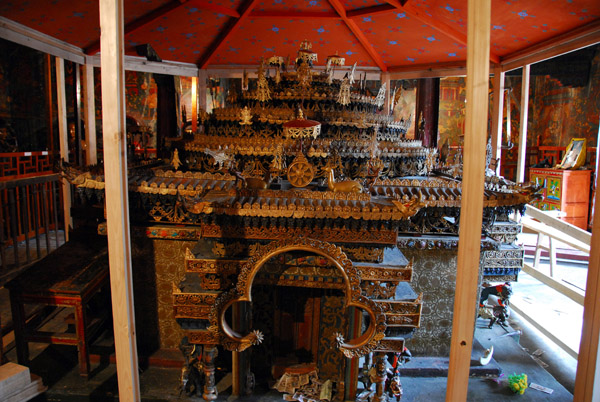 A three dimensional bronze mandela dedicated to Samvara, Lamdre Lagyu Chapel on the upper level receiving a new glass case