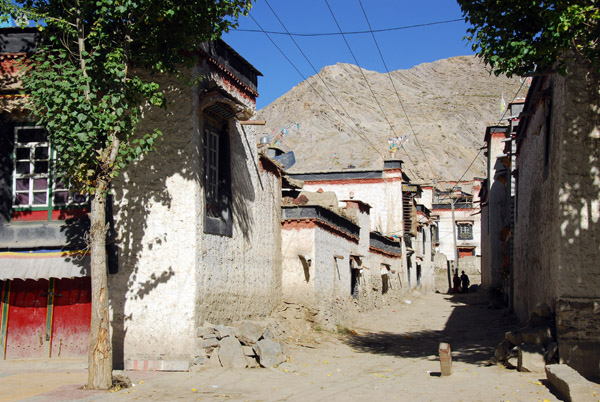 A dusty side street leading deeper into old town Gyantse from Pelkor Road