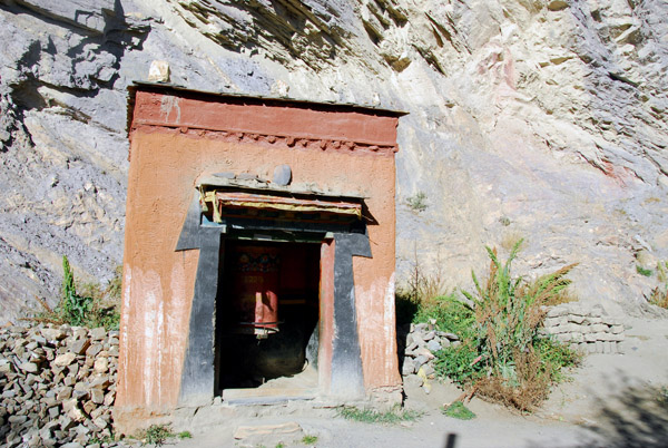 Village shrine with a large prayer wheel