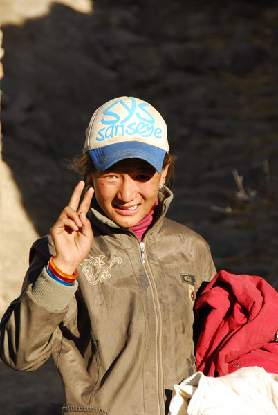 Greeting from a Tibetan girl in old town