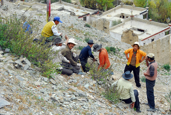 Curious Tibetan laborers at Tsechen Monastery