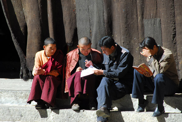 Monks in the central courtyard (khyamra) Sakya Monatery