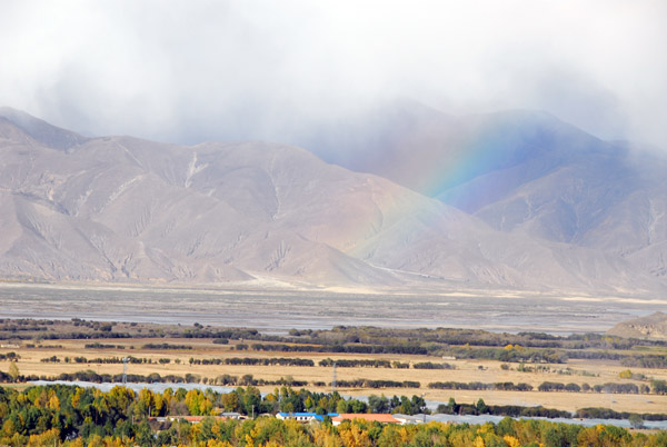 A faint rainbow across the valley