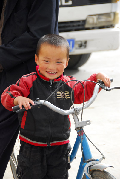 Small boy with a bike, Shigatse