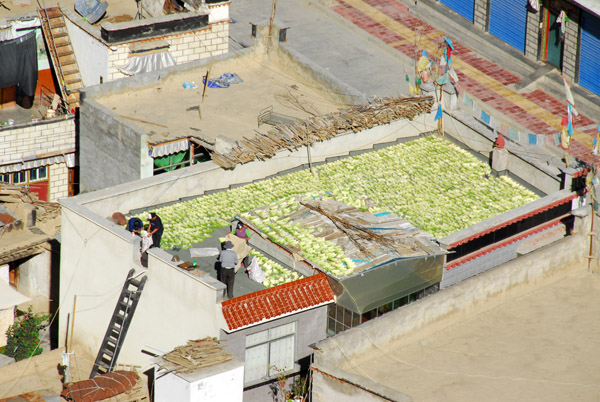 Produce spread out on a roof in old town Shigatse