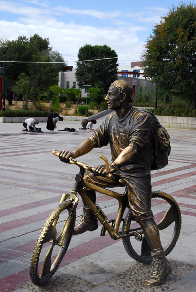 Statue of a boy ona mountain bike with a t-shirt reading Zhongguo (China)