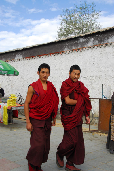 Tibetan monks walking outside Tashilhunpo Monastery