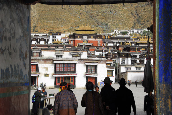 Tibetans entering Tashilhunpo Monastery through the main gate