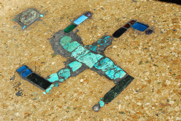 Swastika of semi-precious stones embedded in the pavement, Tashilhunpo Monastery