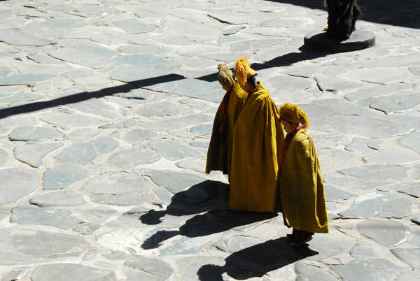 Young monks gathering in the courtyard before noon prayers in the main assembly hall