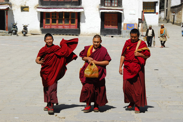 Monks headed for the monastery gate after noon prayers