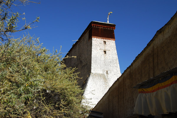 Kora Circuit passing behind the festival thangka wall of Tashilhunpo Monastery