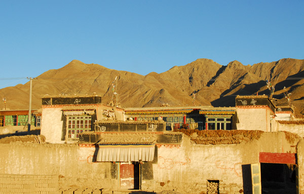 Mud bricks out to dry in front of a traditional Tibetan House