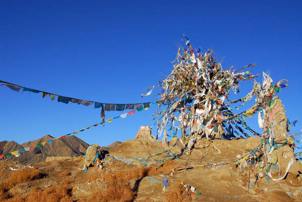 Prayer flags on the ruins of Nartang Monastery