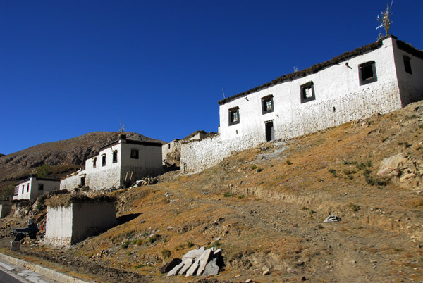 Roadside village of whitewashed Tibetan houses