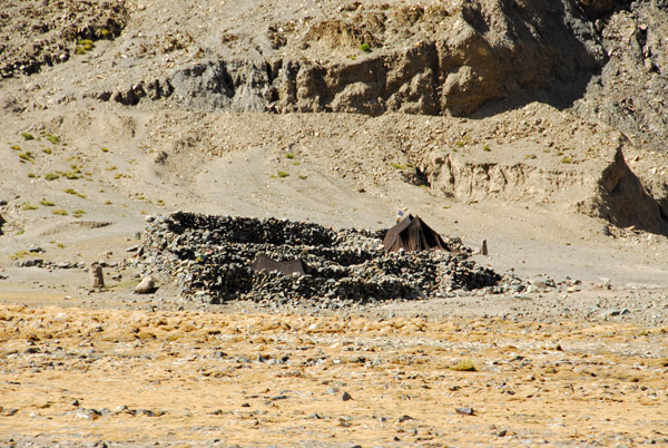 Ruins used as shelter from the wind for nomad tents