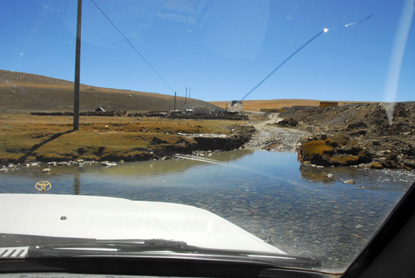 Land Cruiser fording a small stream at km 5282