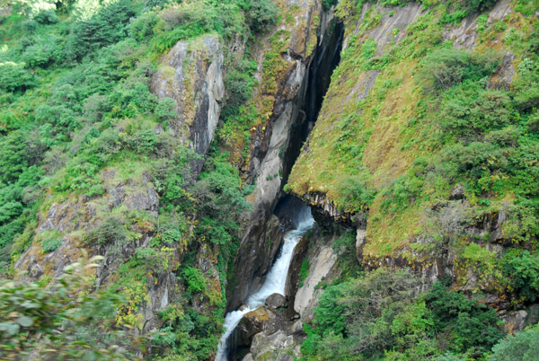 Waterfall in a narrow slot canyon outside Zhangmu