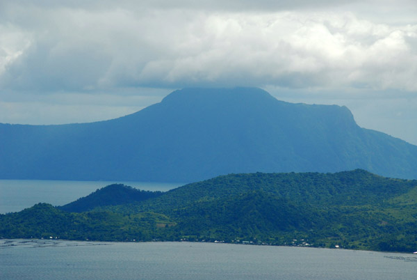 Volcano Island with Mount  Makulot's summit in the clouds across Lake Taal