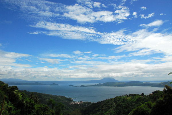 Partly cloudy blue sky over Lake Taal from the Tagaytay Highlands