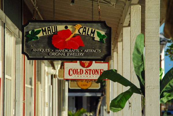 Painted wood shop signs along Front Street, Lahaina's main drag