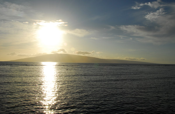 The sun sinking over the island of Lanai