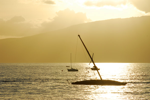 Sunset from Lahaina with a wrecked sailboat and the island of Lanai