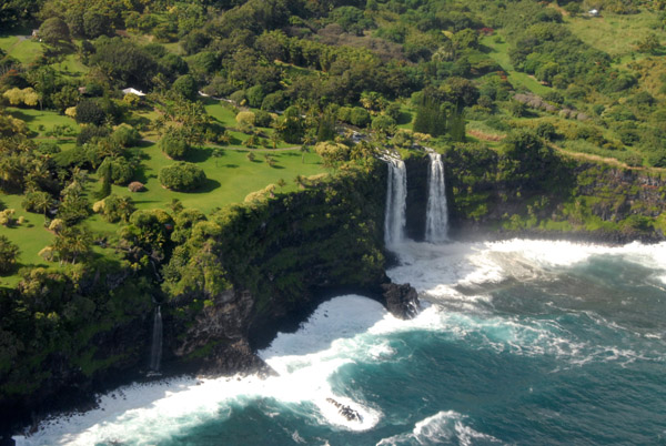 A double waterfall plunging over the cliff directly onto Kea'a Beach, Maui