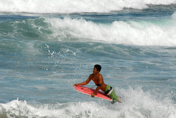 Hawaiian boogie-boarder, Fleming Beach, Maui