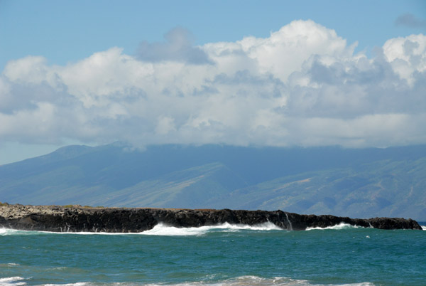 Makalua-puna Point, a small spit of lava on the left side of Fleming Beach known as Dragon Teeth