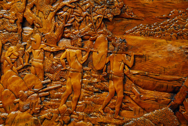 Panel 2: Men carrying the completed stone money down to the canoes for the return voyage to Yap